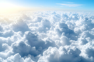 Fototapeta premium Aerial view of fluffy white cloudscape under a bright sky.