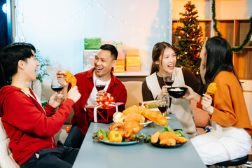 Friends celebrate Christmas with gift exchanges, festive food, and laughtera perfect scene for holiday and New Year