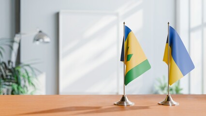 FLAGS OF SAINT VINCENT AND UKRAINE ON TABLE