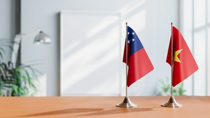 FLAGS OF SAMOA AND VIETNAM ON TABLE