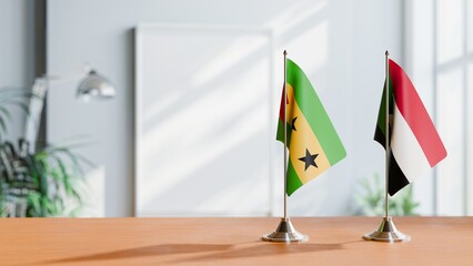 FLAGS OF SAO TOME AND SUDAN ON TABLE