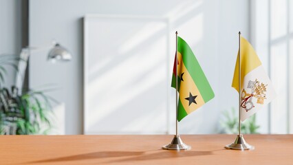 FLAGS OF SAO TOME AND VATICAN ON TABLE