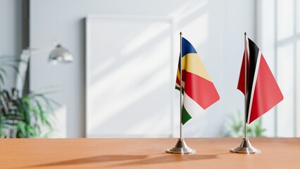 FLAGS OF SEYCHELLES AND TRINIDAD ON TABLE