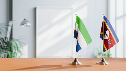 FLAGS OF SIERRA LEONE AND SWAZILAND ON TABLE