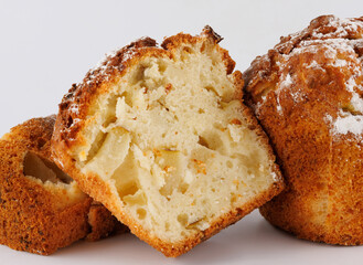 Cut delicious muffin on a white background.