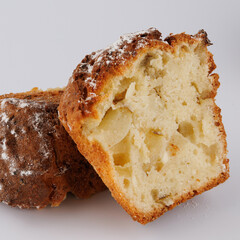 Cut delicious muffin on a white background.