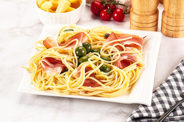 Pasta spaghetti with olives and jamon