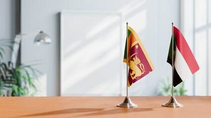 FLAGS OF SRI LANKA AND SUDAN ON TABLE