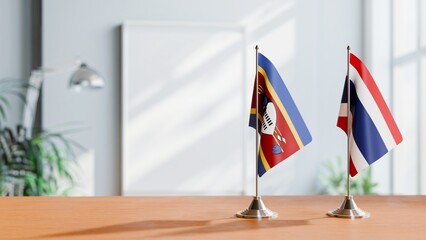 FLAGS OF SWAZILAND AND THAILAND ON TABLE