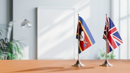 FLAGS OF SWAZILAND AND UNITED KINGDOM ON TABLE