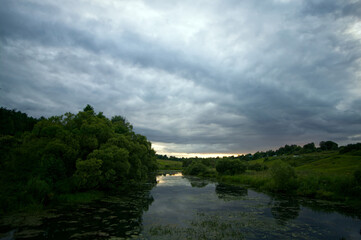 Fototapeta premium A small river on a cloudy day