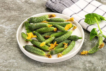 Raw gherkin cucumbers in the bowl