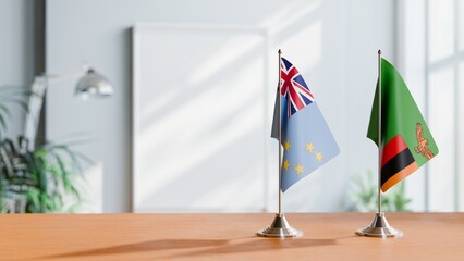 FLAGS OF TUVALU AND ZAMBIA ON TABLE