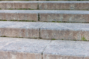 Granite steps of a gray staircase close-up