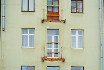 Balcony renovation of historic building, reinforcement of building. Restoration, repair work. Structural repair, concrete reinforcement of historic building facade. Balcony installation, renovation