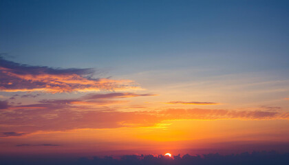Obraz premium Sun Setting Over Clouds in Sky and Copy Space
