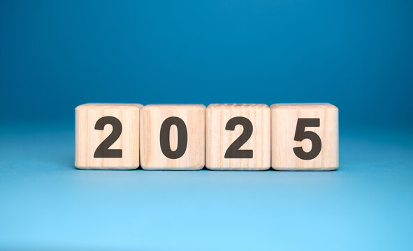 Numbers 2025 on cubes on a blue background
