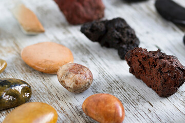 Collection of stones of different types on a gray background