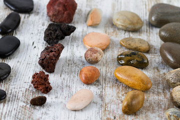 Collection of stones of different types on a gray background