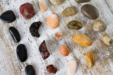 Collection of stones of different types on a gray background