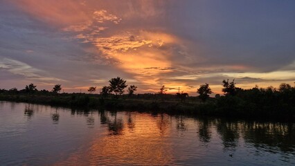 sunset sky over the river (silhouette)