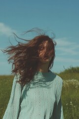 Woman enjoying a sunny day in nature.