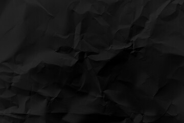 Crumpled black paper with a bold grunge texture. Perfect for dramatic backgrounds, graphic design, posters, or digital art needing a rough, vintage, or handmade look.