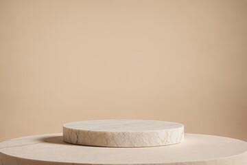 Two tiered marble podium against beige background