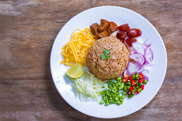 Shrimp paste fried rice or Khao kluk kapi is a delicious Thai dish that combines many ingredients such as shrimp paste, mixed with Thai jasmine rice and various side dishes.