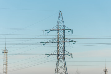 power transmission line supports on a frosty winter day