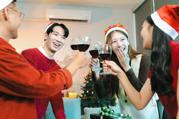 drinks and conversation, people celebrating together at Merry Christmas and Happy New Year. Friends are happy and celebrating with food, wine and friendship of love and gift exchange at the event.