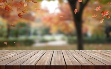 Wood table with falling fall leaves in park, bokeh background.