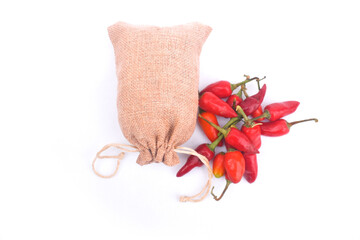 red hot Chili Peppers isolated on white background, clipping path, full depth of field pot...