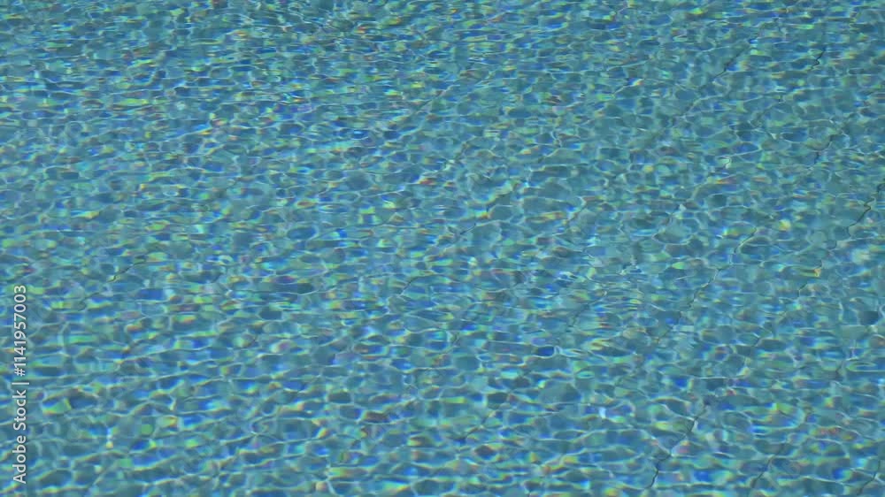 Poster empty swiiming pool, ripple effect, refocusing from water surface to bottom background