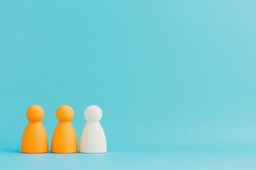 Three colorful figurines stand against a vibrant blue background, representing teamwork, diversity, and collaboration.