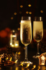 Two glasses with champagne in New Year Eve and Christmas style
