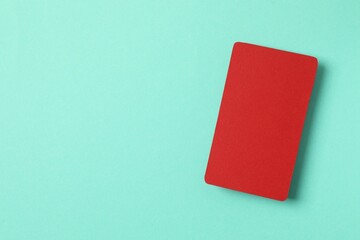 Red paper card on color background. Empty greeting card for text design