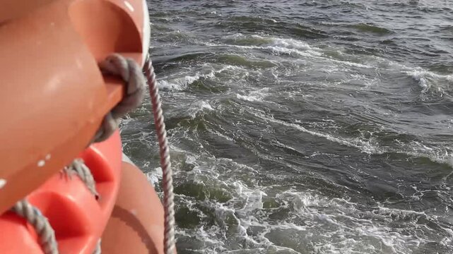 Waves and Life Buoy from the Boat