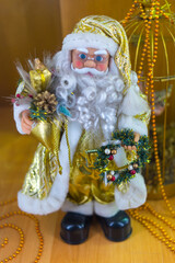 Christmas Santa Claus figure with gifts and holiday decorations