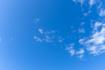 Low angle view and full frame of beautiful blue sky with strange shape of clouds in the morning or evening in sunny day used as natural background texture in decorative art work