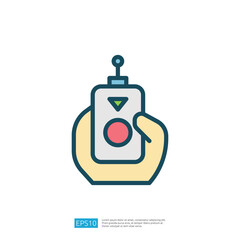 A hand holding a remote control with a circular button and an antenna, suggesting operation or control of a device.