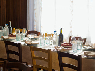 The top down view of a dining room table set for the holidays
