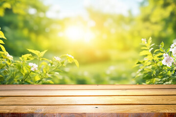 Spring beautiful background with green juicy young foliage and empty wooden table in nature...