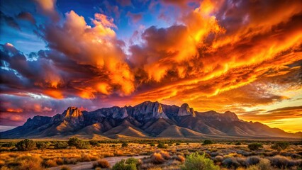 New Mexico's Sandia Mountains: a vibrant sunset paints dramatic clouds and peaks in pink and orange.