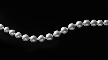 Diagonal String of White Pearls on a Black Background
