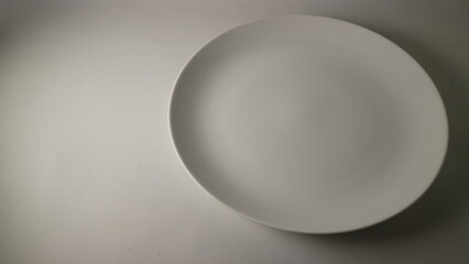 Empty White Oval Plate on White Background
