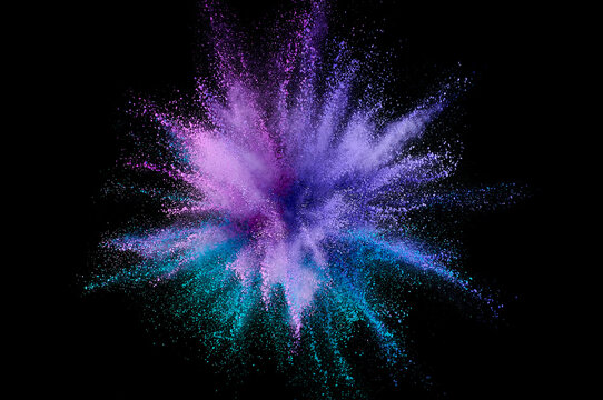 Colored powder explosion. Abstract closeup dust on backdrop. Colorful explode. Paint holi