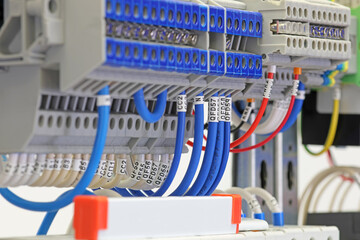 Connection of electrical modules using insulated mounting wires. Close-up. Soft focus.