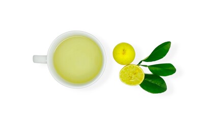 A cup of lemon wedang or lemon tea in a cup and saucer served with lemon slices on a white background. A cup of hot lemon juice for health.