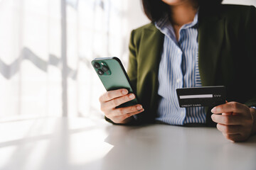 Portrait of filling out credit card information on a smartphone. Shopping online Online credit card payment concept